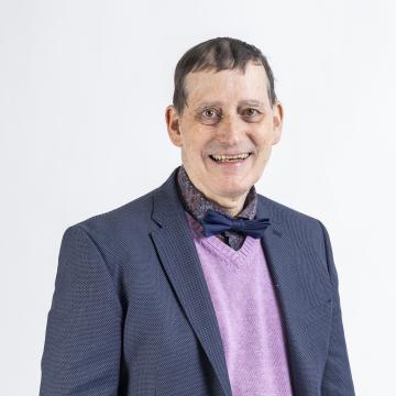 Foto Armin Nowak mit Sakko und blauer Fliege